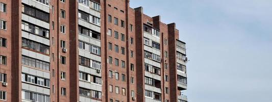 Old multi-storey apartment house in a poorly-developed region of Ukraine or Russia photo