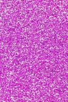 Pink decorative sequins. Background image with shiny bokeh lights from small elements photo
