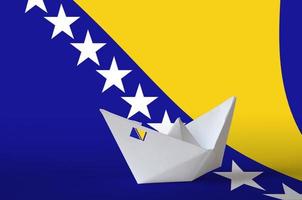 Bosnia and Herzegovina flag depicted on paper origami ship closeup. Handmade arts concept photo