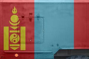 Mongolia flag depicted on side part of military armored truck closeup. Army forces conceptual background photo