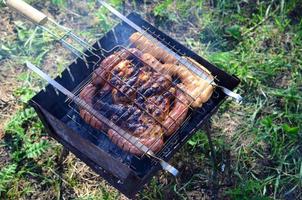 Poor and improper cooking meat on fire. Toasted meat with overcooked crust photo