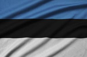 Estonia flag  is depicted on a sports cloth fabric with many folds. Sport team banner photo