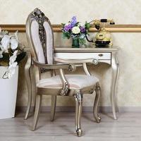 A fragment of a retro interior with a chair and a desk on which is located a telephone and a vase of flowers photo