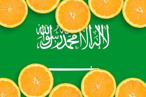 Saudi Arabia flag  in citrus fruit slices horizontal frame photo