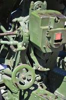 A close-up mechanism of a portable weapon of the Soviet Union of World War II, painted in a dark green color photo