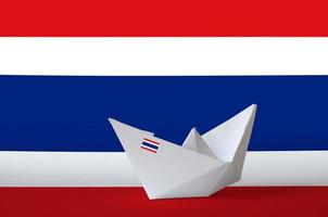 Thailand flag depicted on paper origami ship closeup. Handmade arts concept photo