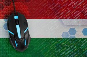 Hungary flag  and computer mouse. Digital threat, illegal actions on the Internet photo