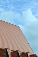 The house is equipped with high-quality roofing of metal tiles. A good example of perfect modern roofing. The building is reliably protected from adverse weather conditions photo