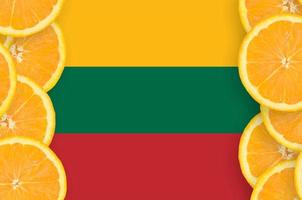 Lithuania flag  in citrus fruit slices vertical frame photo