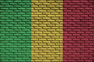 Mali flag is painted onto an old brick wall photo