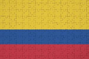 Colombia flag  is depicted on a folded puzzle photo