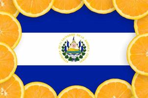 El Salvador flag  in fresh citrus fruit slices frame photo