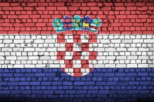 Croatia flag is painted onto an old brick wall photo