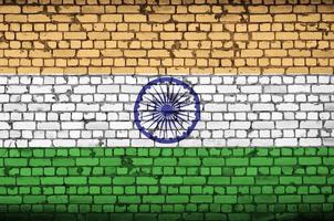 India flag is painted onto an old brick wall photo