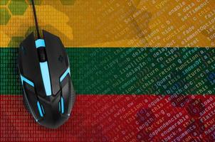 Lithuania flag  and computer mouse. Digital threat, illegal actions on the Internet photo