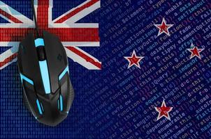 New Zealand flag  and computer mouse. Digital threat, illegal actions on the Internet photo