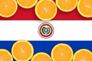 Paraguay flag  in citrus fruit slices horizontal frame photo