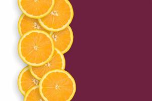 Qatar flag and citrus fruit slices vertical row photo