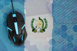 Guatemala flag  and computer mouse. Digital threat, illegal actions on the Internet photo