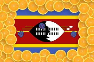 Swaziland flag  in fresh citrus fruit slices frame photo