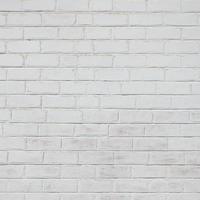 la textura de la pared de ladrillo, pintada de blanco foto