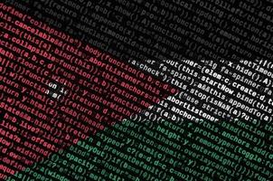 Jordan flag  is depicted on the screen with the program code. The concept of modern technology and site development photo