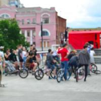 Defocused image of a lot of people with bmx bikes. Meeting of fans of extreme sports photo