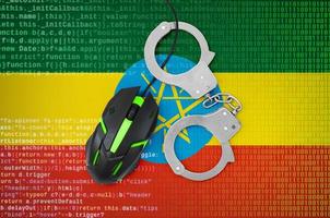 Ethiopia flag  and handcuffed computer mouse. Combating computer crime, hackers and piracy photo