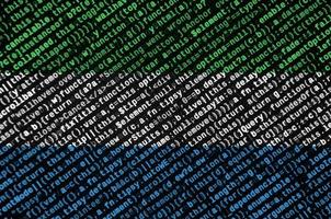 Sierra Leone flag  is depicted on the screen with the program code. The concept of modern technology and site development photo