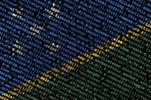 Solomon Islands flag  is depicted on the screen with the program code. The concept of modern technology and site development photo