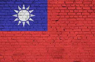 Taiwan flag is painted onto an old brick wall photo