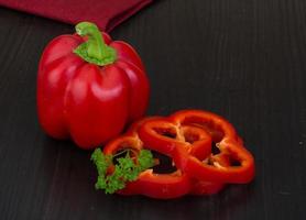 Red pepper on wood photo