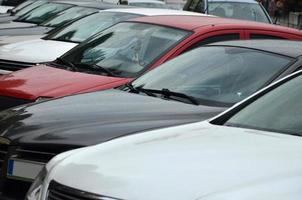 Roofs of several cars. A lot of cars stand close at rush hour photo