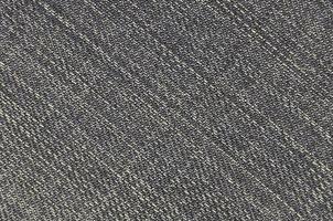 Detailed texture of dark denim cloth photo