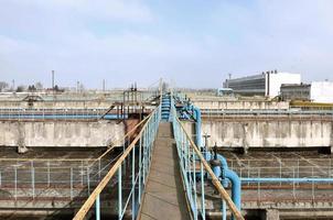 Industrial space with lots of pipes and communications photo