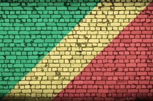 Congo flag is painted onto an old brick wall photo