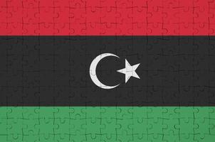 Libya flag  is depicted on a folded puzzle photo