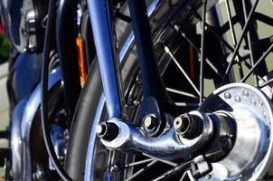 Fragment of chromed shiny wheel of old classic motorbike photo