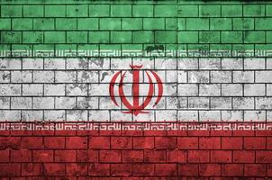 Iran flag is painted onto an old brick wall photo