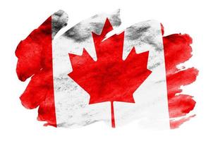 Canada flag  is depicted in liquid watercolor style isolated on white background photo