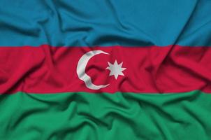 Azerbaijan flag  is depicted on a sports cloth fabric with many folds. Sport team banner photo