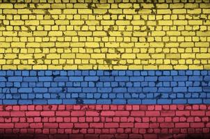 Colombia flag is painted onto an old brick wall photo