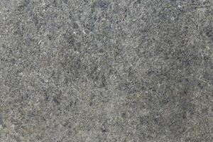 Grey shimmering background imitation dust with shiny balls. Abstract pattern sequins. Template round particles. Fresh asphalt, granite or marble photo