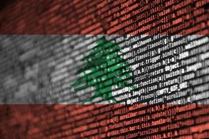 Lebanon flag  is depicted on the screen with the program code. The concept of modern technology and site development photo