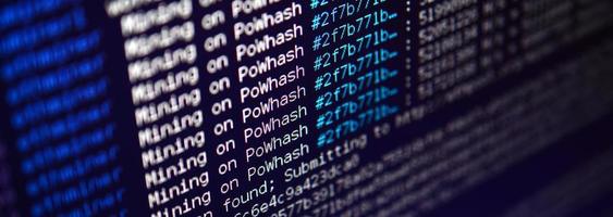 Macro snapshot of the program interface for crypto currency mining on the monitor of an office computer. The concept of mining bitcoins. The flow of information strings and data photo