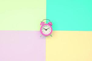 Time to choose metaphor concept. Alarm clock at the crossroads of different colors photo