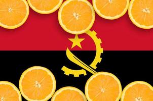 Angola flag  in citrus fruit slices horizontal frame photo