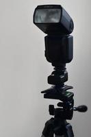 Speedlight gun with trigger set mounted on tripod photo