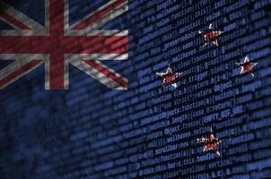 New Zealand flag  is depicted on the screen with the program code. The concept of modern technology and site development photo