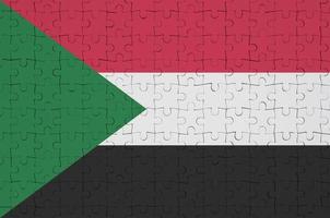 Sudan flag  is depicted on a folded puzzle photo